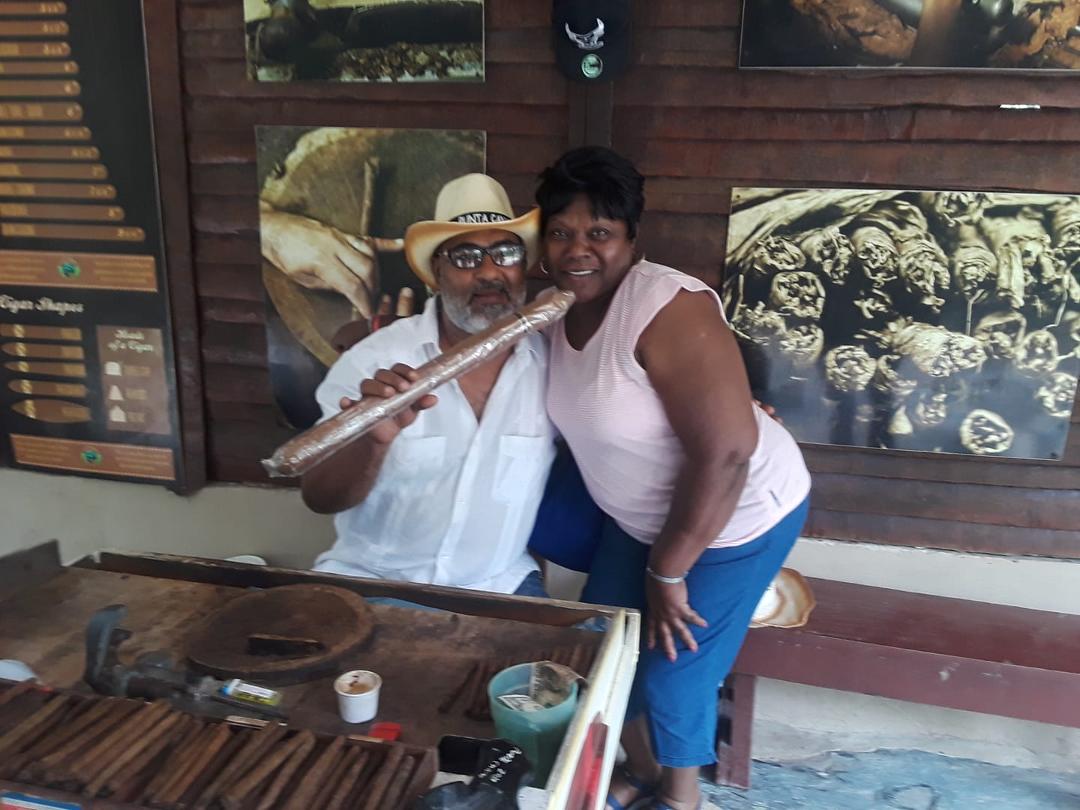 Showing out.  My classmates and I watched that young man make a cigar.  Dominican Republic is tobacco rich.  As well as producer of coffee,  cocoa,  coconut,  and of course banana trees.
