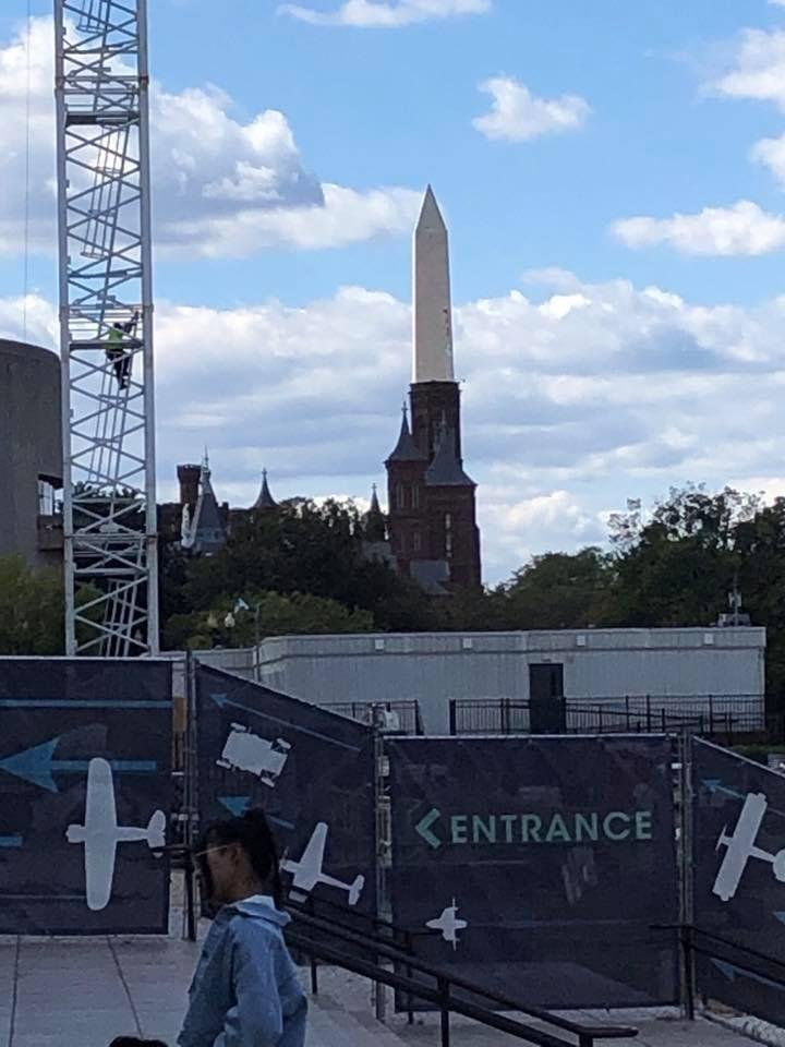 I know this is an optical illusion but it looks like the Washington Monument is coming out the turret of the Smithsonian castle