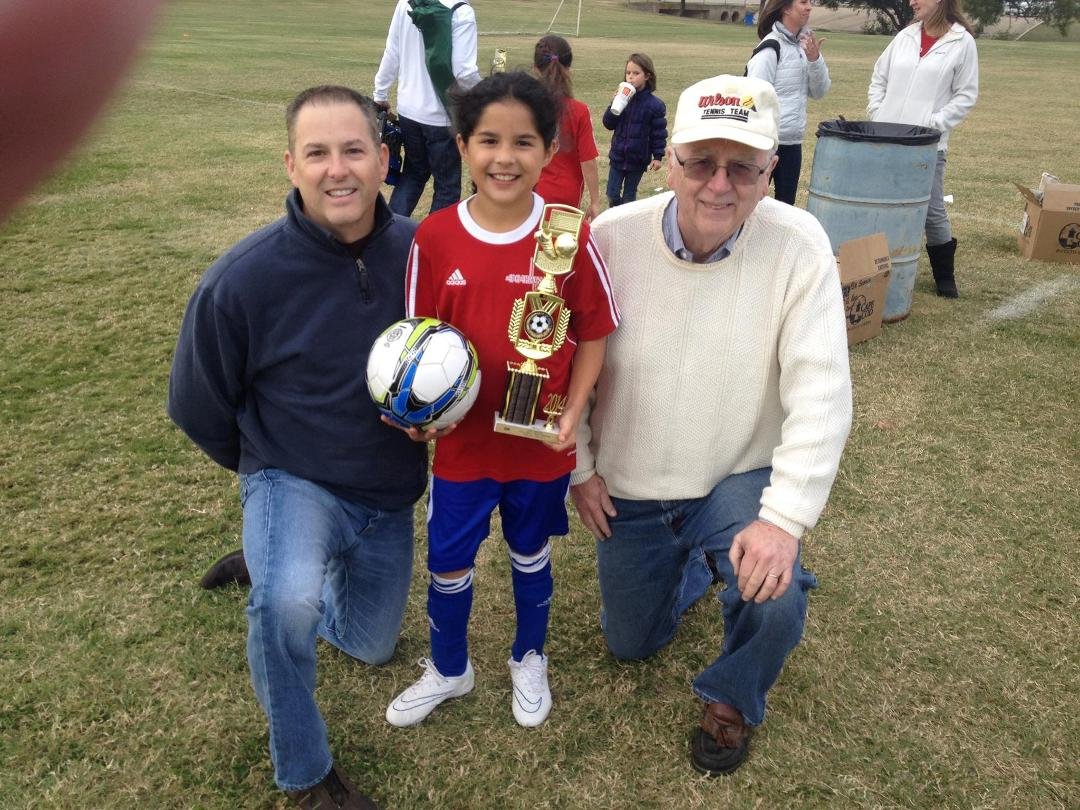 Soccer playoffs over and they came away with this big trophy. Here is Carli with her dad and grandad, Tom and Bob. Carli brought home a straight A 4th grade report card this week too!
