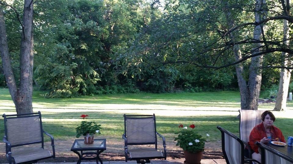 Setting on the patio with newspaper and a martini.  Relaxing, temp 74.  This is the view.