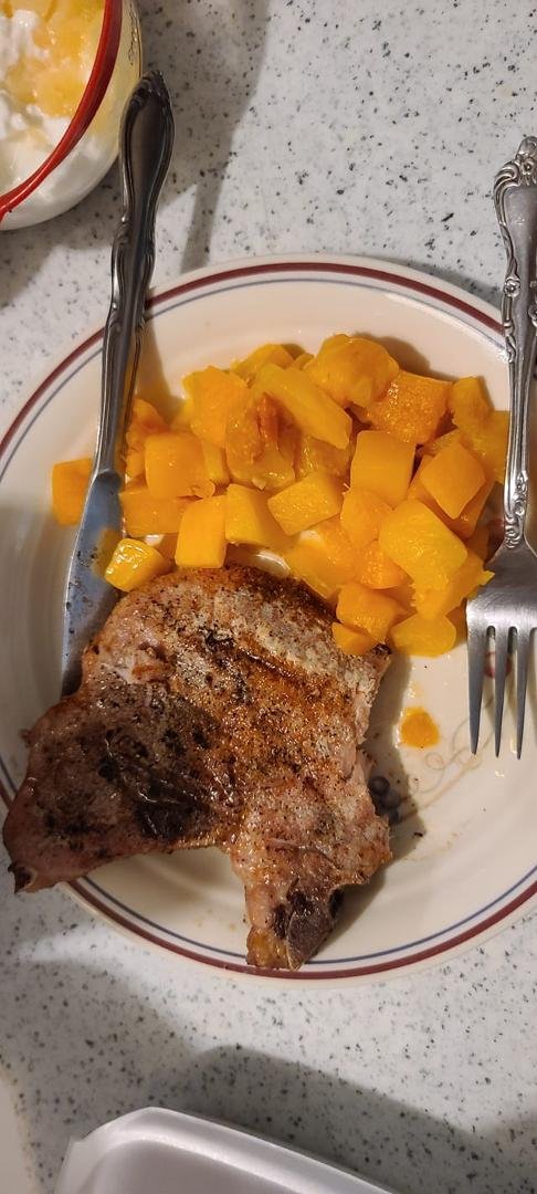 Grilled pork chops and cubed butter nut squash