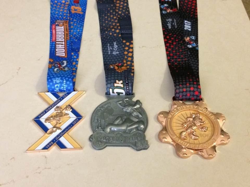 Jim's three medals...he ran around the lake to say he ran for the third one