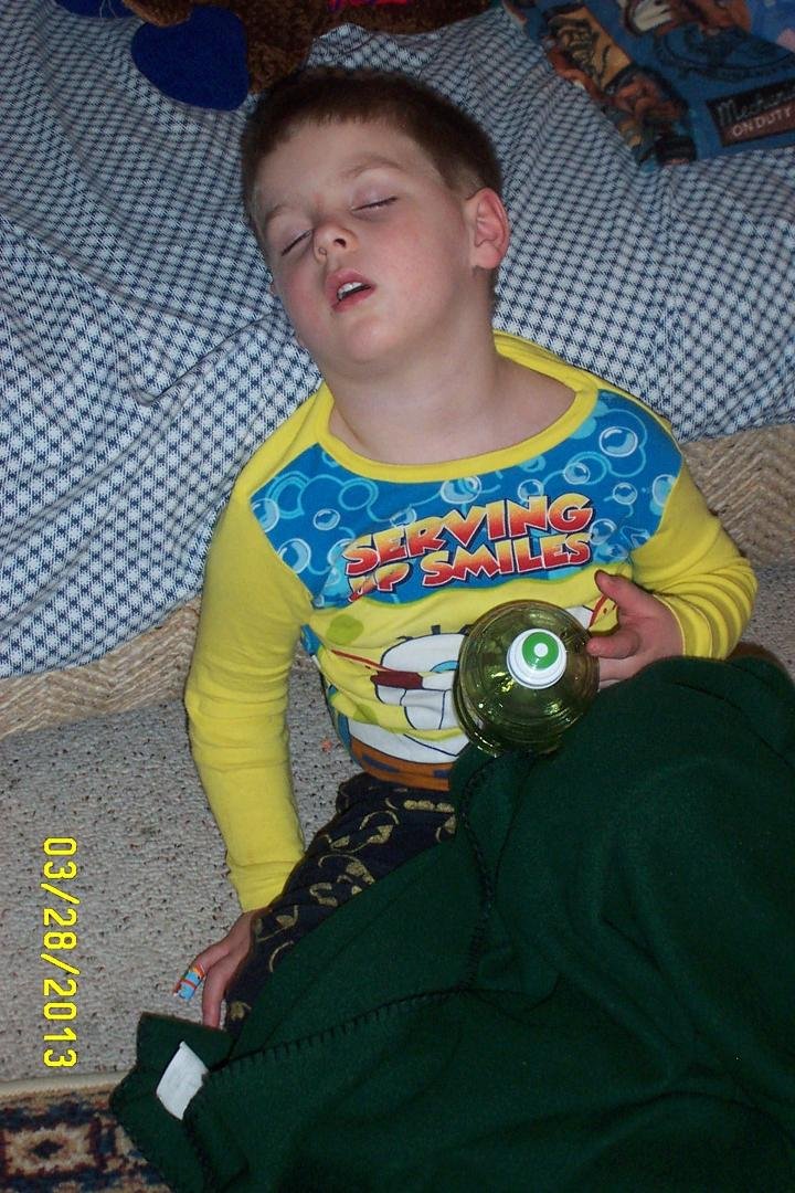 Zadyn Nesbitt new sleeping position, on the floor with head againt the sofa.