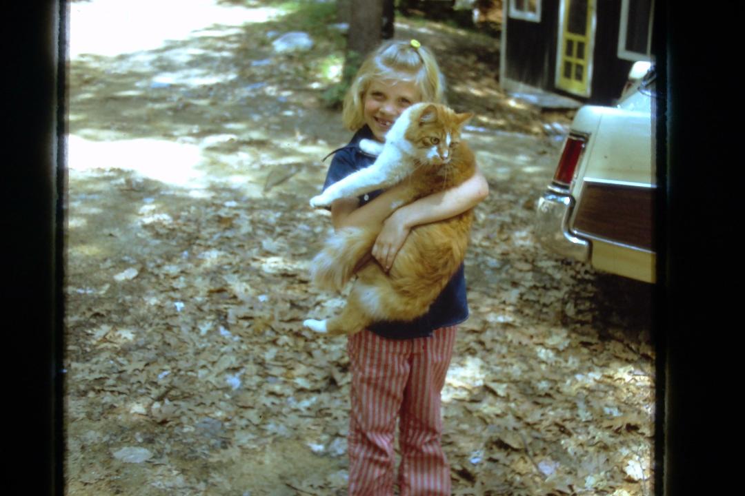 Beautiful Beth loving her kitty at camp.