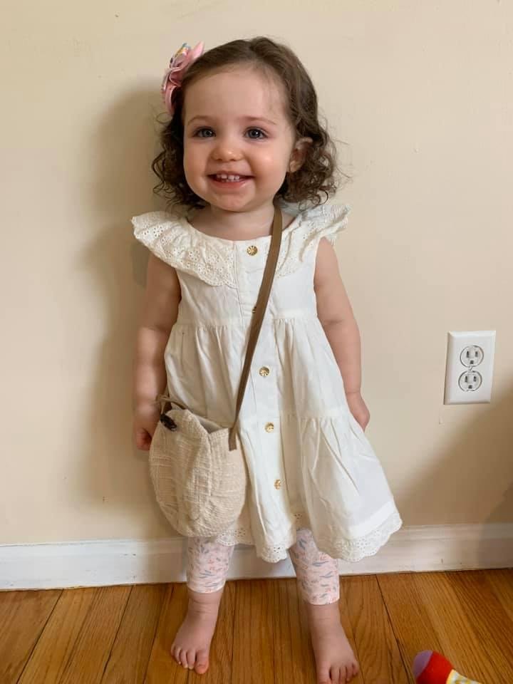 My great granddaughter wearing her Easter outfit