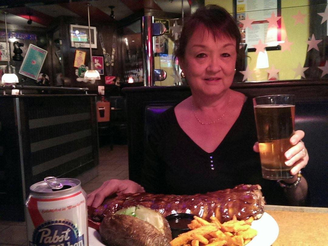 At TGIF enjoying ribs and a tall cold one! All for 10.99!