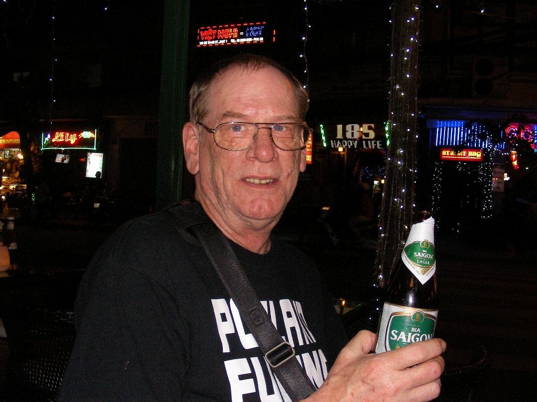 On the street in Saigon, drinking a birthday beer!