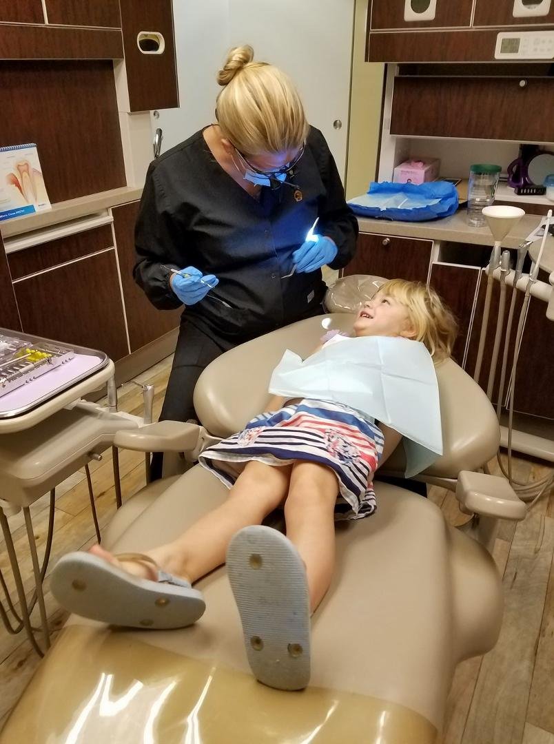 Counting her teeth. Just a get acquainted appointment.
