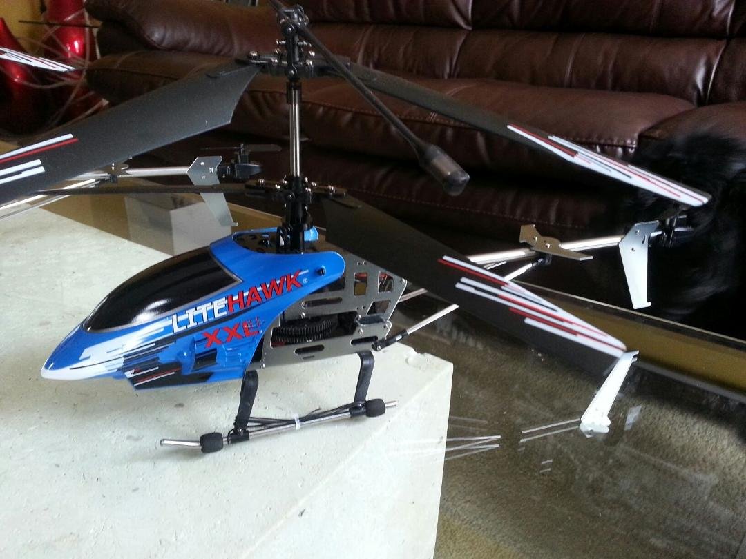 I was shopping for Christmas Presents years back and this guy in PoloPark was flying one around....it was so cool. Since then I have always wanted an RC Helicopter. Well temptation finally got the best of me yesterday an