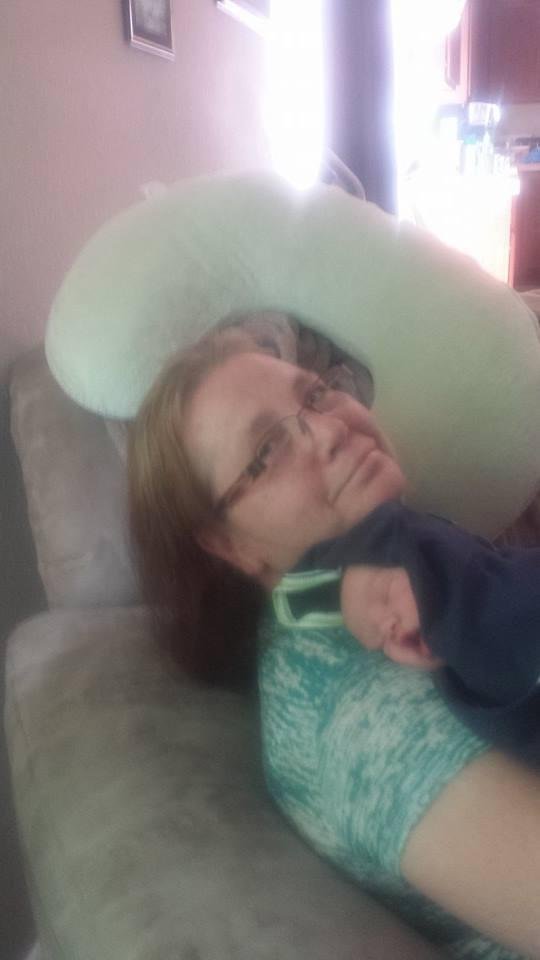 My beautiful wife with our new grandson.