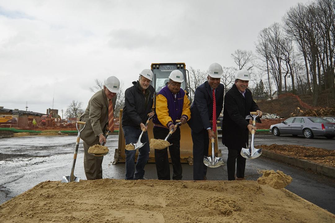 Didn't you always want to do this? Another perk of being a public official. Note the 3 Democrats who know how to shovel.