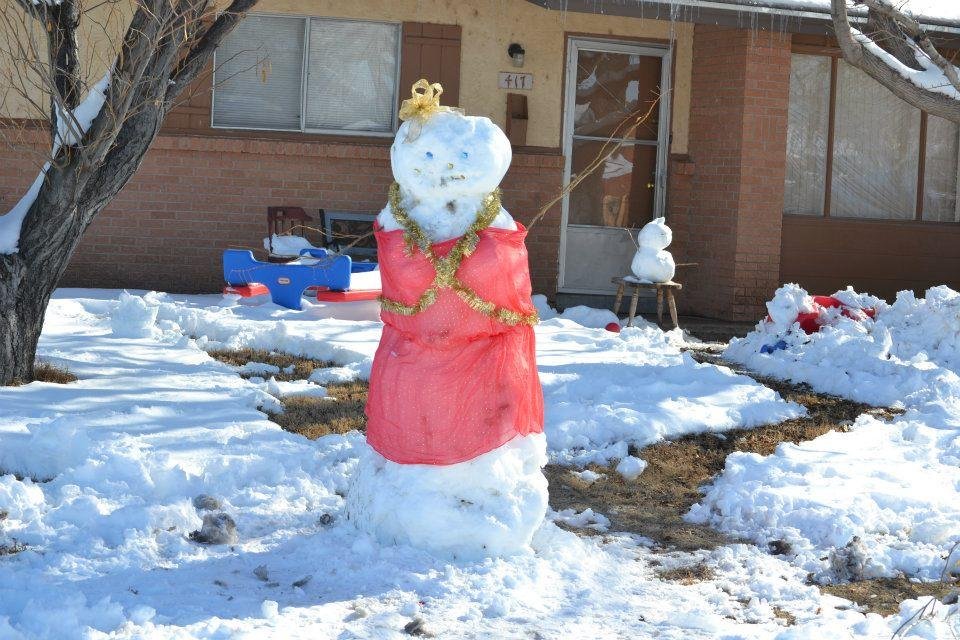 OUR NEIGHBORS' SNOW DIVA.  IN THE BACKGROUND IS A SNOW KITTY! 12.27.11