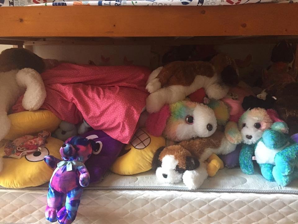 My granddaughter Ifra can no longer sleep in her own bed due to her collection of stuffed animals.