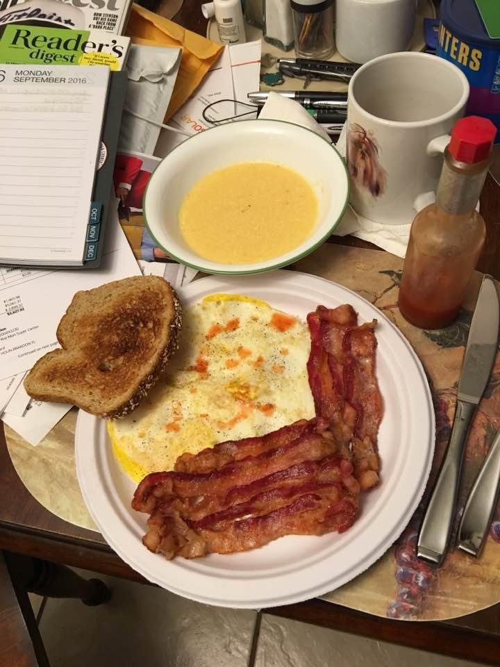 Bachelor Breakfast.
3 XL eggs (over hard)
1/2 lb. bacon (crispy)
1 pkg. Cheese grits (instant)
1 slice whole grain toast (buttered)
Coffee (with milk)
Plate (paper)
Not bad, but my old live-in cook did it much better.