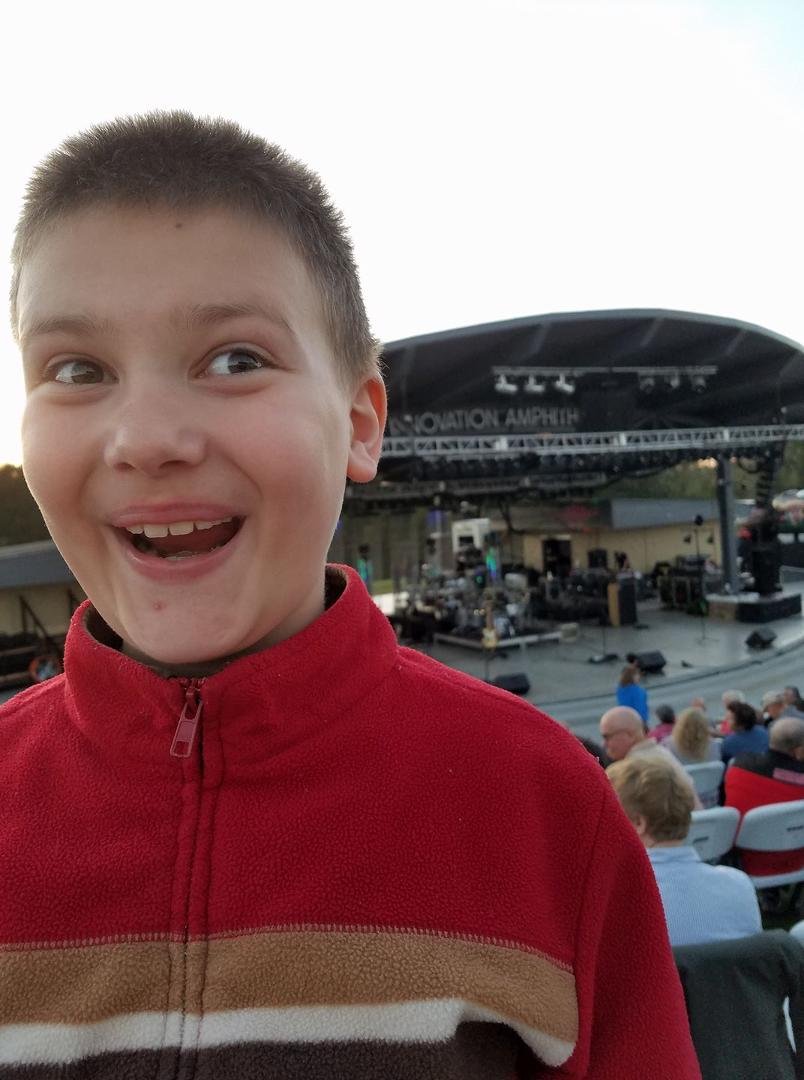 My grandson acting himself at The Oakridge Boys concert with Stephanie Spell Trotter