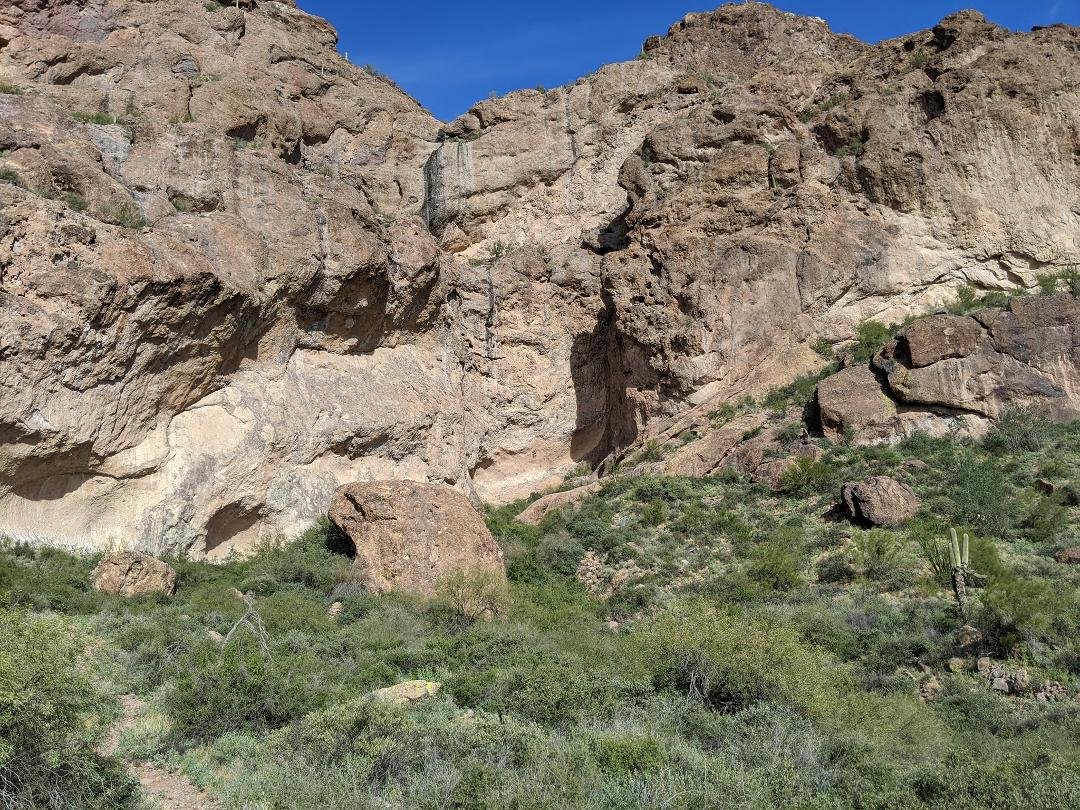 Mineshaft (can't see it) is in the alcove at about one - two o'clock from the large boulder middle left in picture.