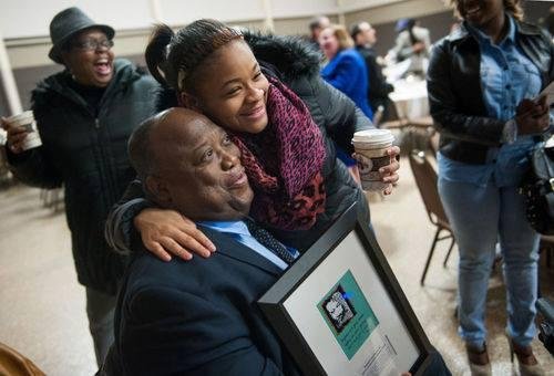 Look at my grandbaby and Rob!!

 Le’Bria Cook congratulates Robert Harrison Sr. on Thursday after he received the 2015 Columbia Values Diversity Individual Award at the Holiday Inn Executive Center. Harrison was honored for
