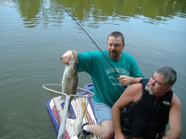 My hubby (in green shirt) Jimmy and freind fishing, had to get skidoo in order to bring in the fish.