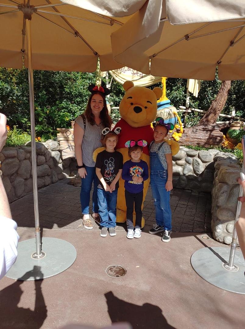 Lindsey and grandkids with Winnie the Pooh!