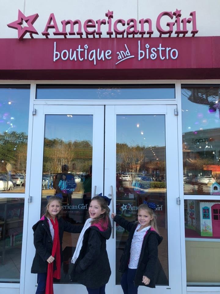 Three little girls having a great experience.