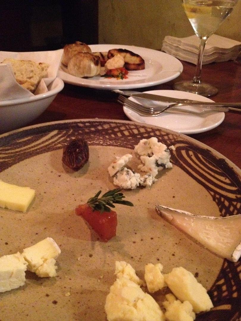 Tasty roasted garlic and cheese plate next