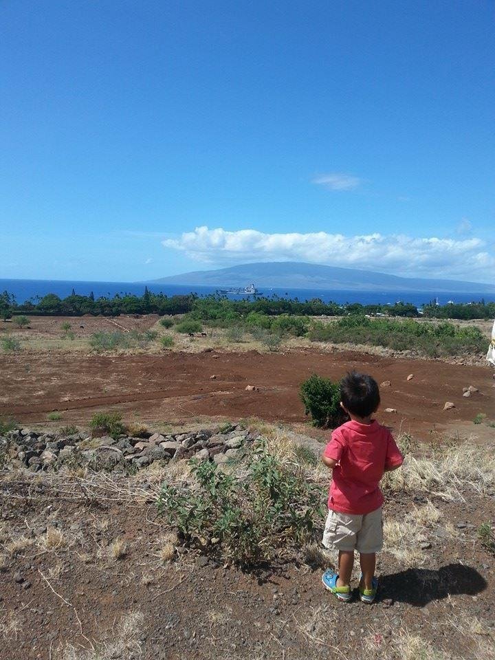 Hes looking at the big ship in da water!