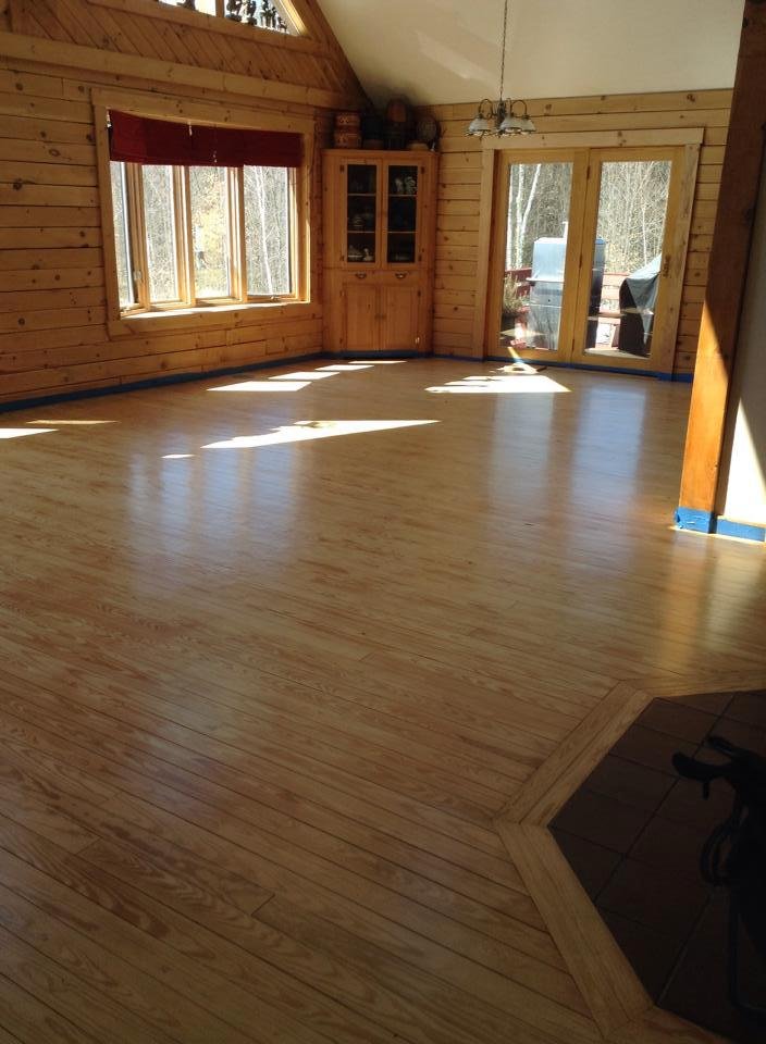 I think we're done. We moved everything out and stripped and sanded and vacuumed and applied expensive chemicals and voila! It looks like new! Now we just have to vacuum every corner of the house and put everything back...