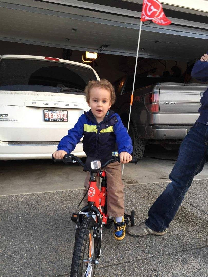 Gavin on his new bike. Just like my grandfather gave to me, here's a present for his upcoming third birthday.