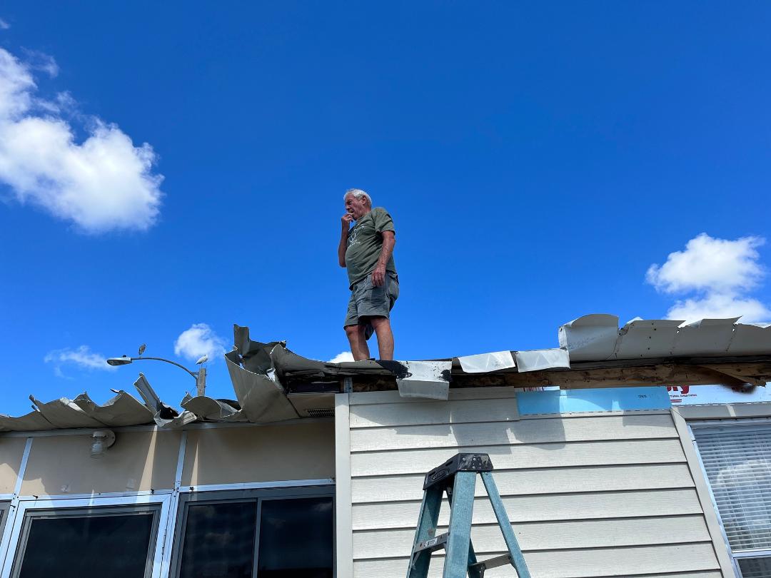 George on my roof trying to figure out what to do next. Thank you so much George for coming to my rescue again