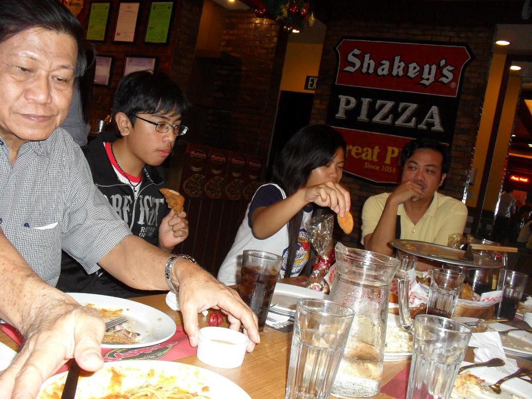 Enjoying eating with the Demafeliz Family.