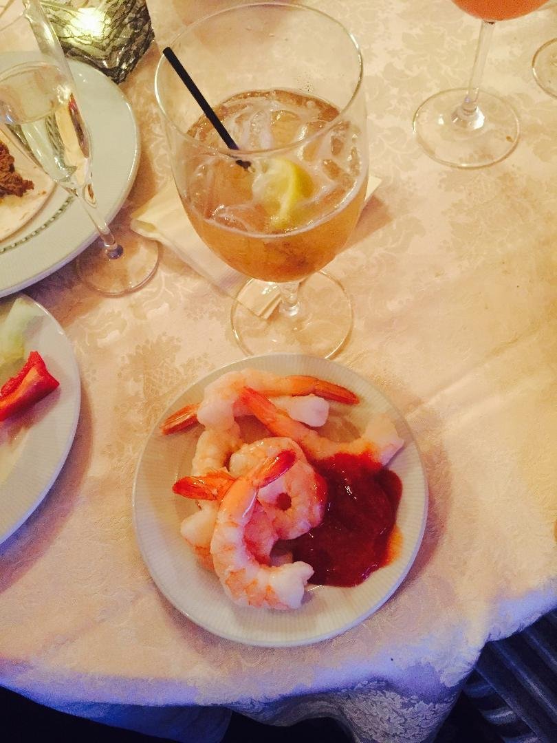 Having my appetizer. Long Island Ice Tea and shrimp cocktail. Just the beginning!
