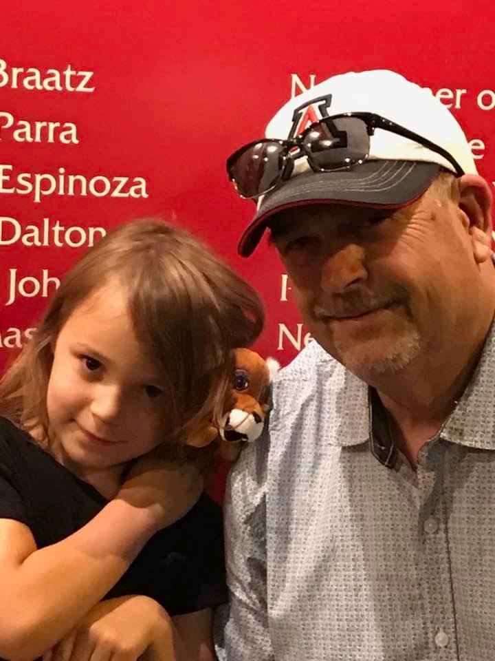 At the Arizona softball game. Two trips to the concession stand in the first inning. Love my Addison!