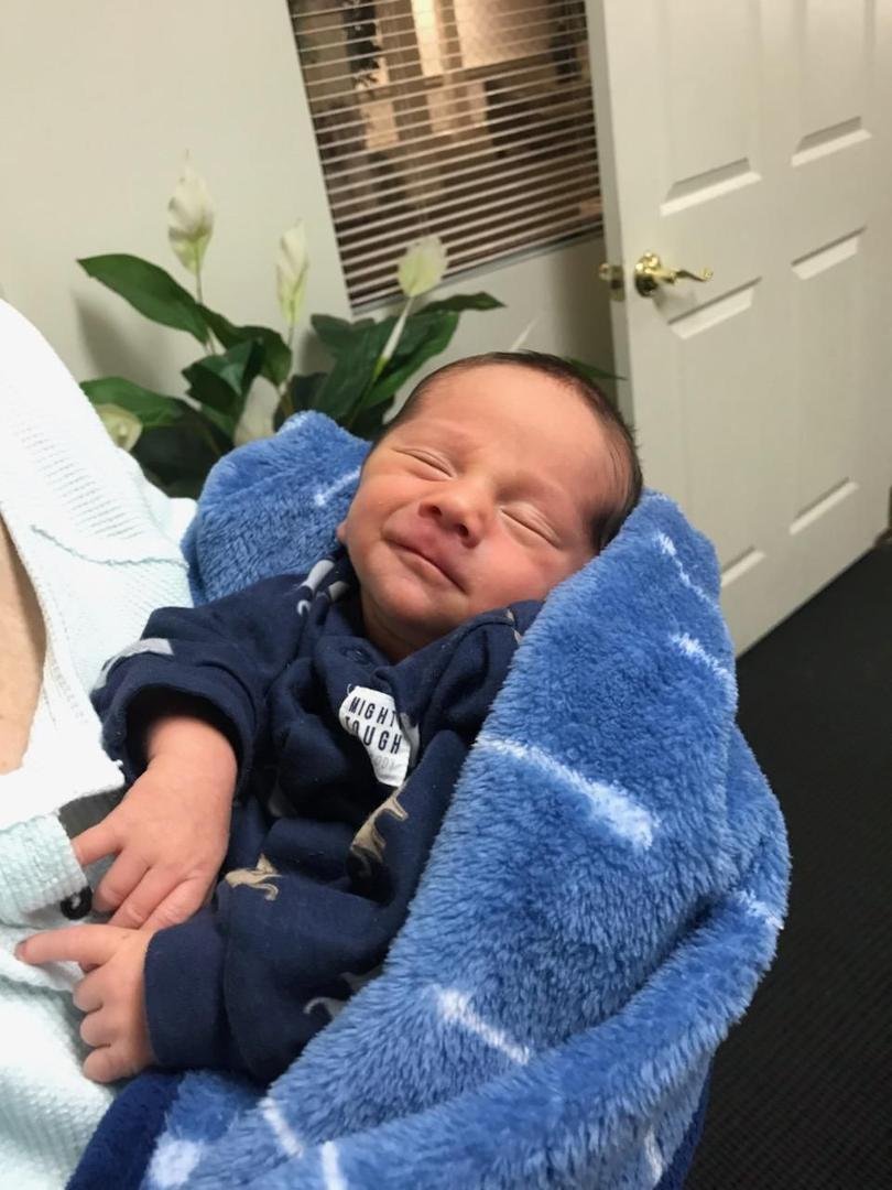 Luke came to visit Grandma today and we went to see Angela in the office. She took the sweet picture of him smiling and said he was talking to the angels