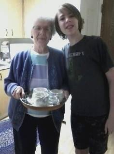 Leif-Eirik towers over his grama and offers to help her in the kitchen.
