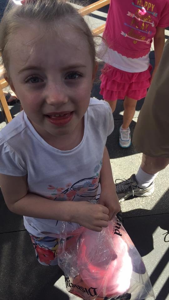 The Monsters Inc. ride just broke and Bella is upset! Lots of tears. Thanks for cotton candy.