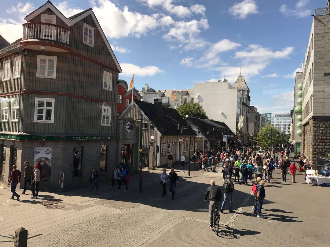 A high traffic, marketing area, of downtown Reykjavic with typical building construction.
