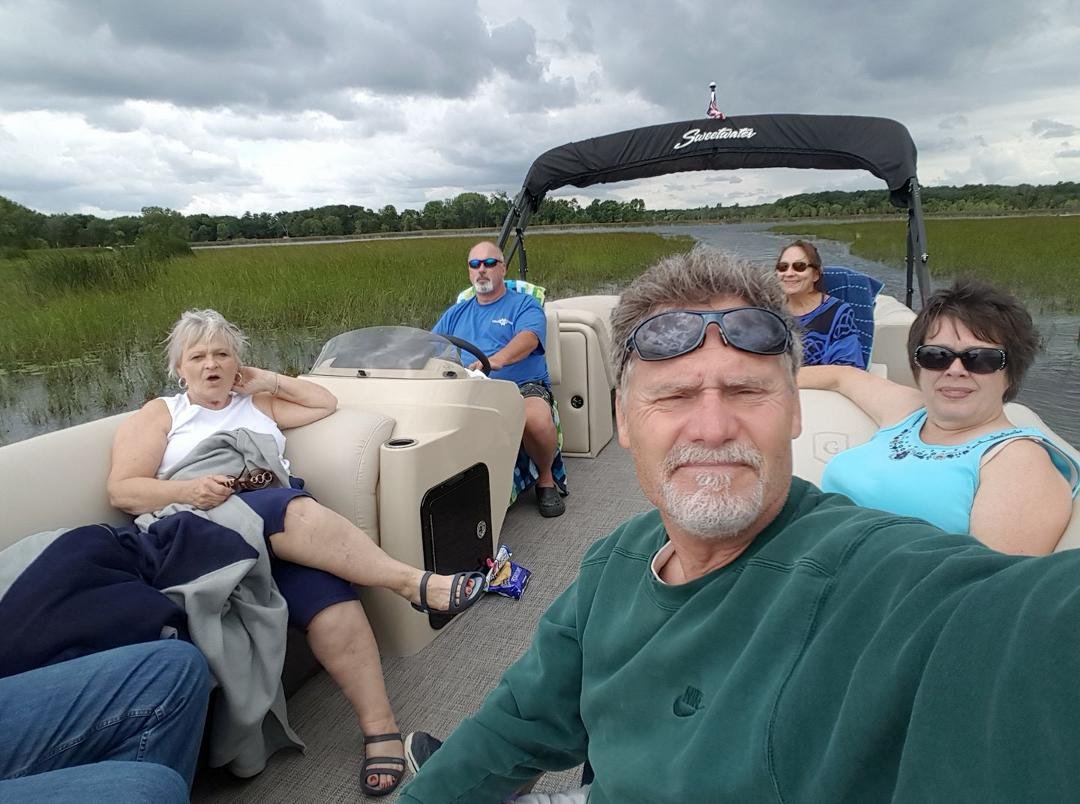 Out on the lake with friends on Clear Lake - Linda, Mike, Mary Ann, Karen and Bob's knees