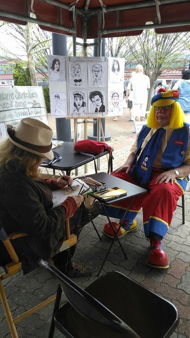 Dee and her talents at work with caricatures galore.
