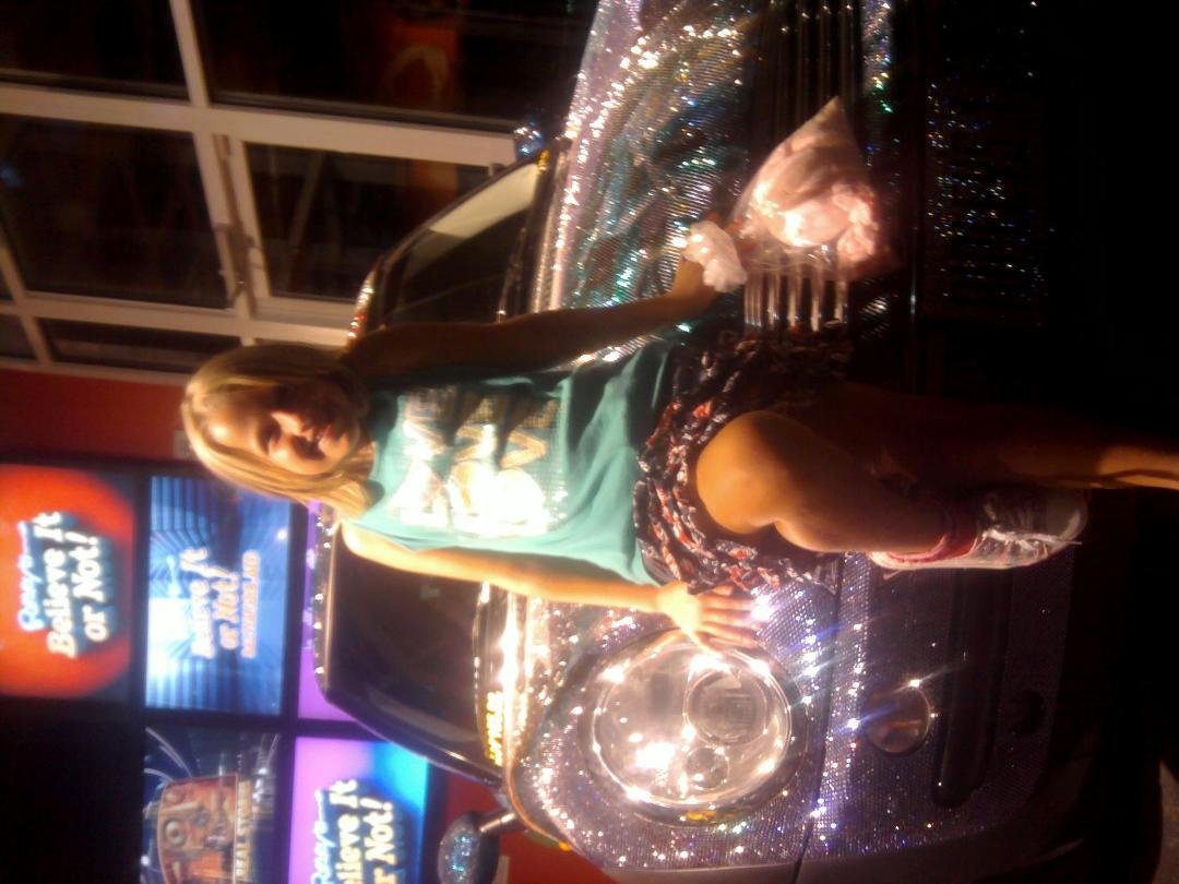 AUGUST 24,2012 Caitlin posing in front of a car..