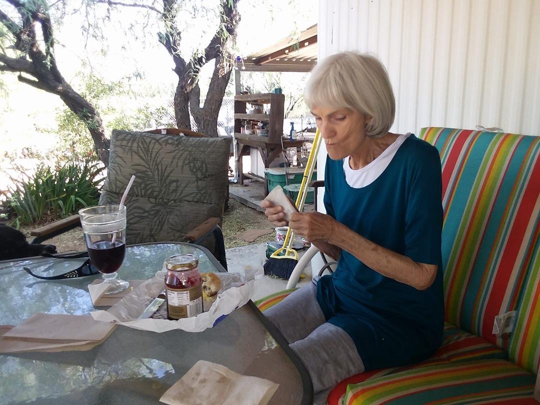 My cute little wife and I having breakfast out on her patio