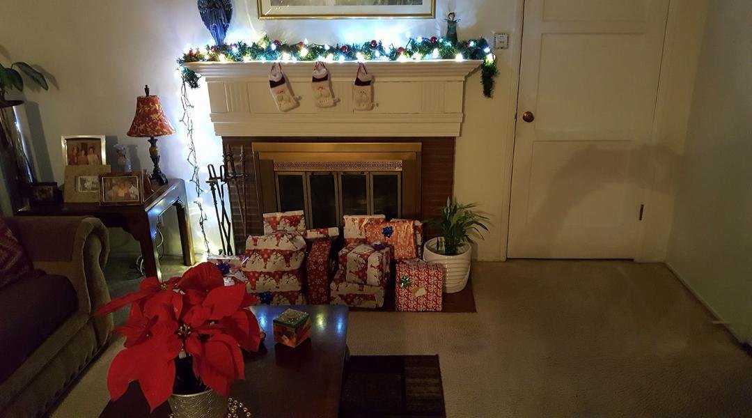 Christmas presents by fireplace