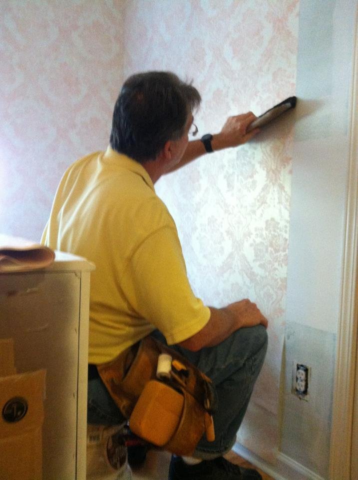 Pawpaw papering Carolina's room! Won't be long now!!