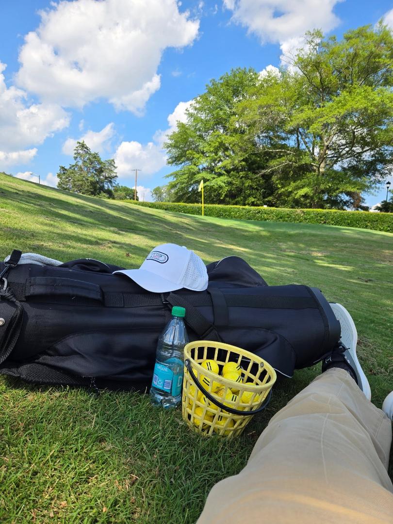 First full day of retirement. Lying in the shade at the golf course after hitting a bucket of balls. Life is good.