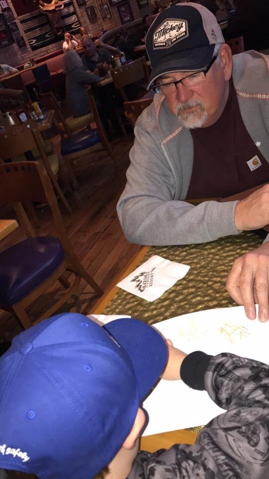 Scott and papa playing tic tac toe