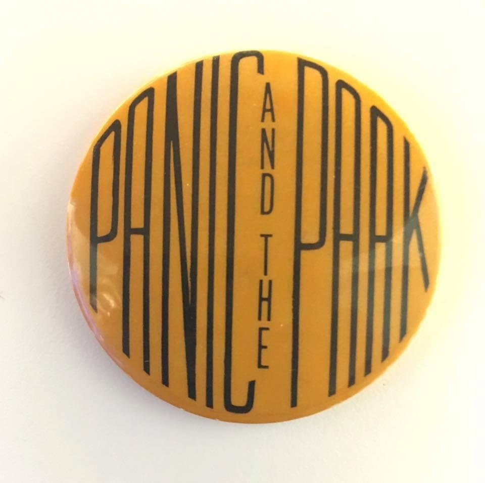 My sister just called me and told me about an estate sale she was at today. She said the home was right out the 50’s, 60’s. On the way out she was looking through a box of jewelry and saw this button, Panic and the Paak a