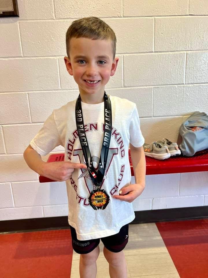 He’s not quite “da Crusher” yet but he is “da Tater”! Congratulations to first grader Tatum Patrick Smith for getting his first pin and finishing third at the Rumble on the River held Sunday at La Crosse Logan High School.