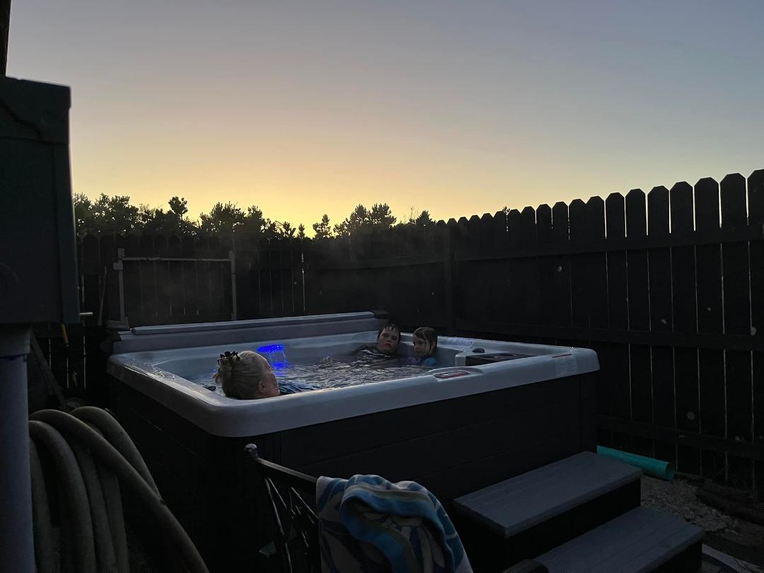 Linda and the Grandkids enjoying a beautiful sunset and some time in the hot tub