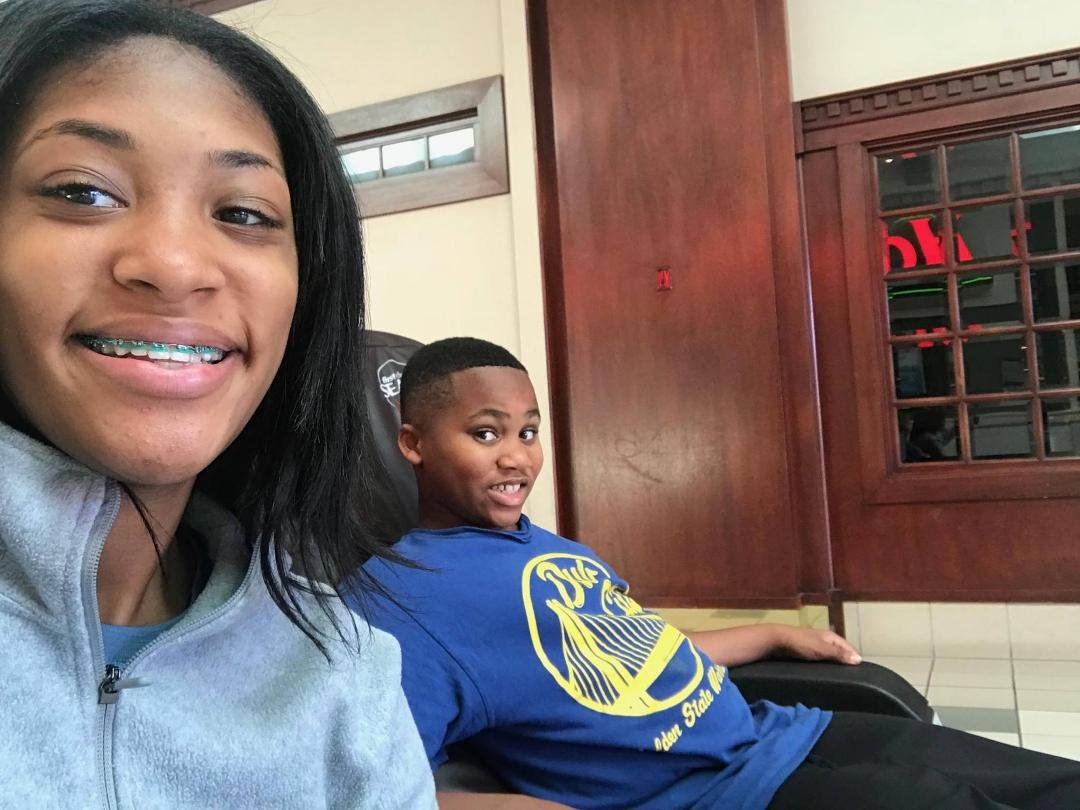 Grandkids Aaliyah and Gregory having fun in Moreno Valley. At Wal-Mart in massage chairs.