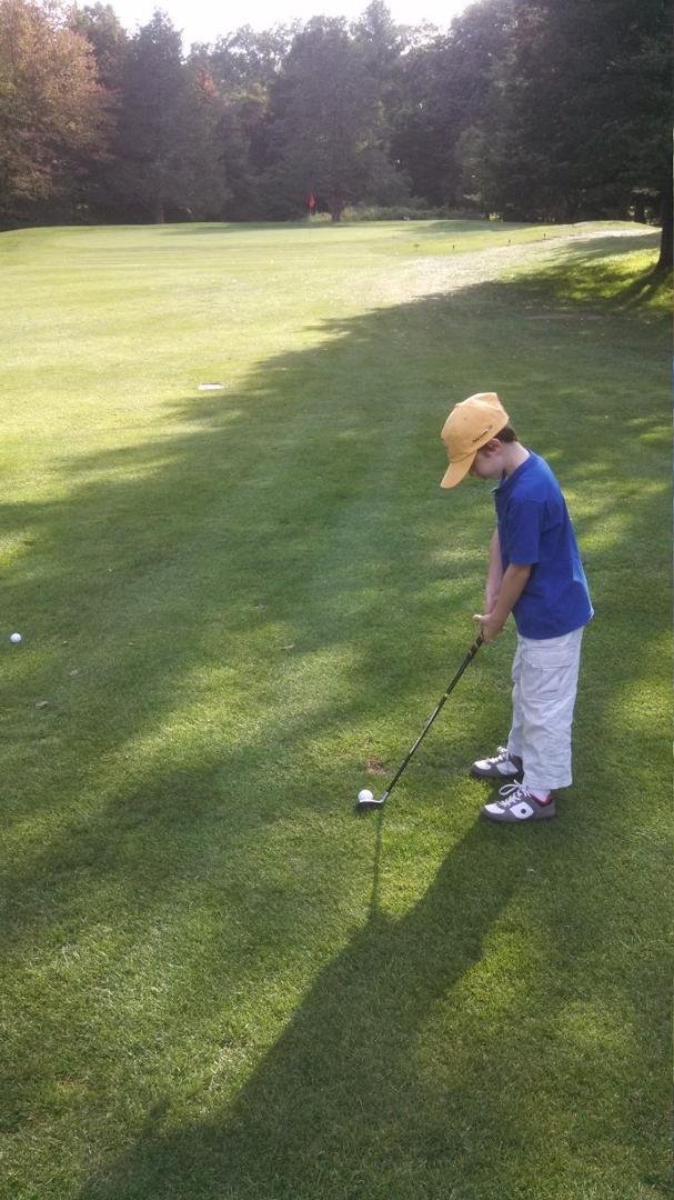 Sam getting ready to chip onto the 8th at Chanticlair GC. He's getting good!