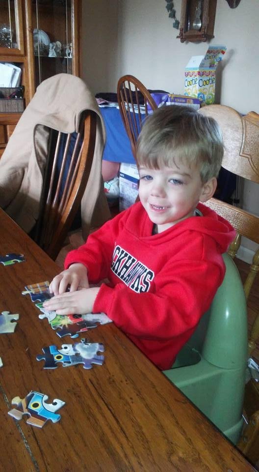 Henry doing his puzzles looking for the muffin man.